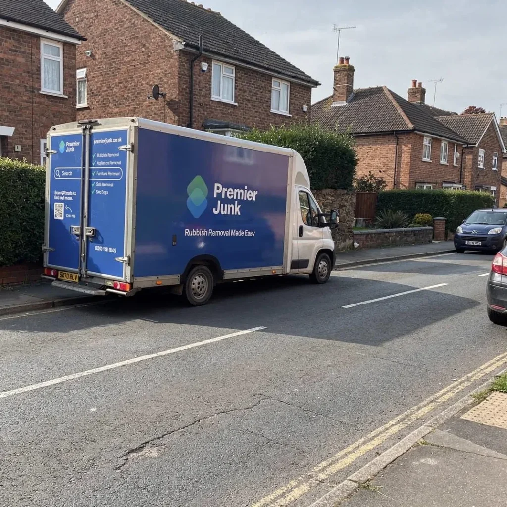 Premier Junk van parked alongside road in Amesbury
