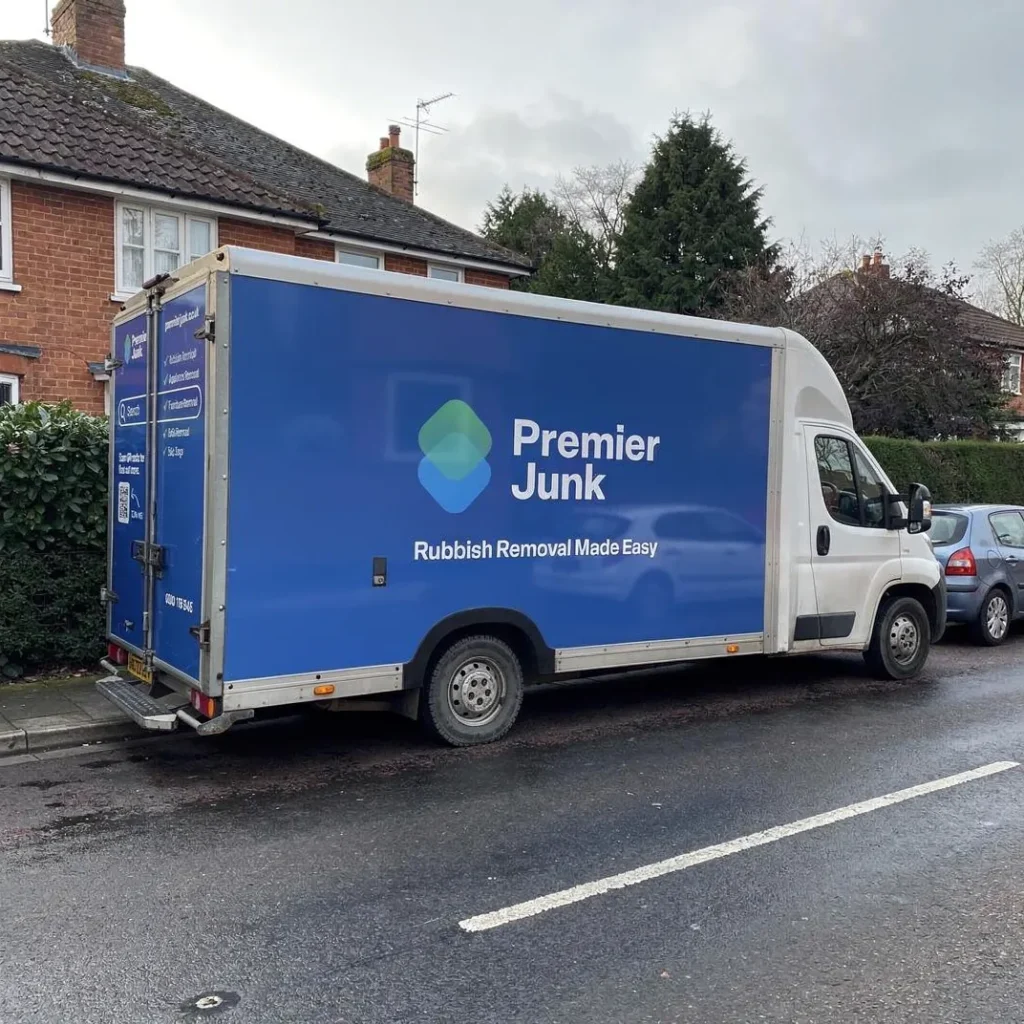 Premier Junk van parked on street in Downton