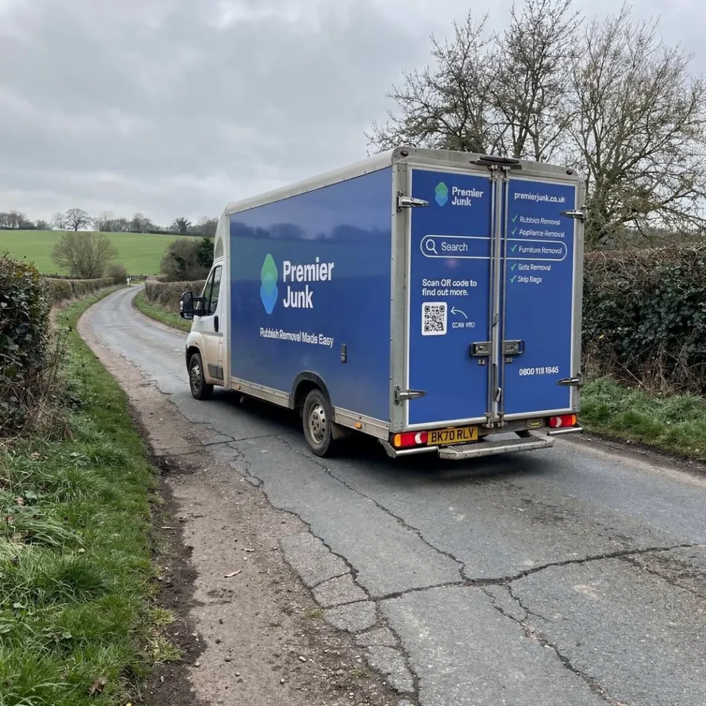 Premier Junk van driving down rural road in Ludgershall