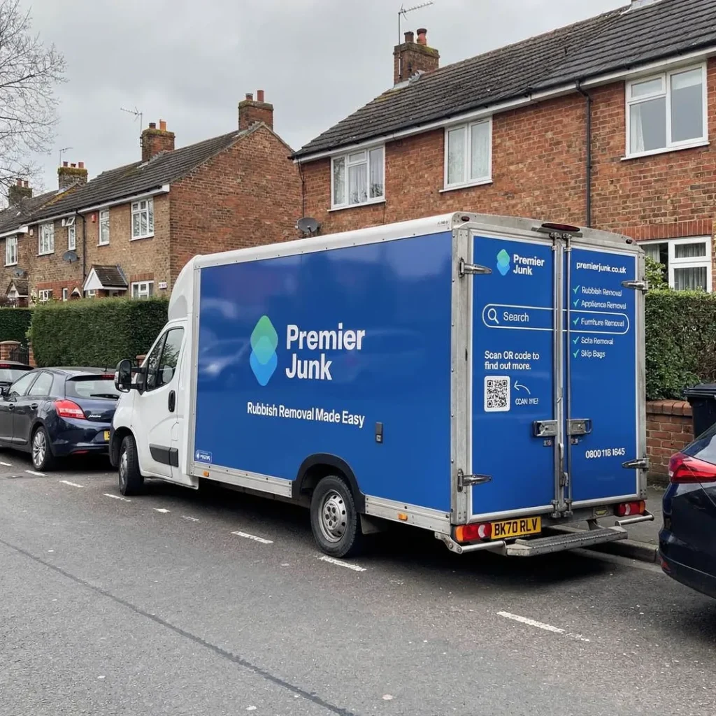 Premier junk van parked outside property in Wimborne